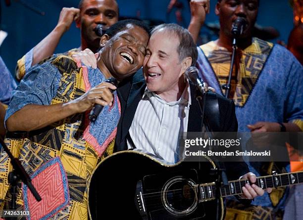 Paul Simon , Joseph Shabalala and other members of Ladysmith Black Mambazo perform during the Library Of Congress Gershwin Prize For Popular Song...