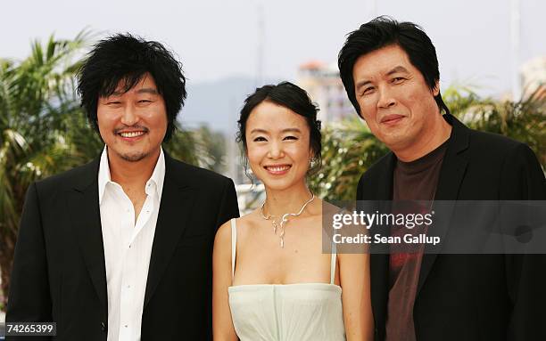 Actor Kang-ho Song, actress Do-yeon Jeon and director Chang-dong Lee attend a photocall to promote the film 'Secret Sunshine' at the Palais des...