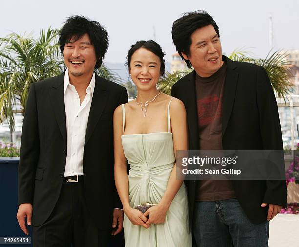 Actor Kang-ho Song, actress Do-yeon Jeon and director Chang-dong Lee attend a photocall to promote the film 'Secret Sunshine' at the Palais des...