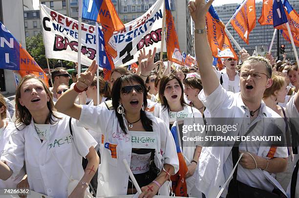 Nurses shout slogans as they demonstrate in Paris 24 May 2007 to demand higher wages and a better regnonition of their diplomas. The nurses...