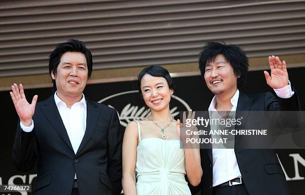 South Korean director Lee Chang-Dong and actors Do-Yeon Jeon and Kang-Ho Song pose 24 May 2007 prior to attend the screening of their film 'Secret...