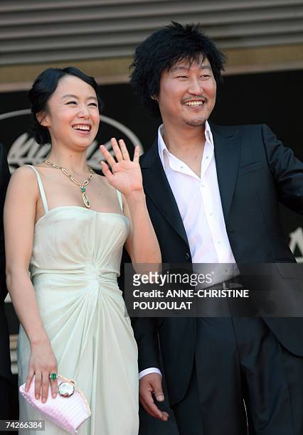 South Korean actress Do-Yeon Jeon waves to the crowd 24 May 2007 as she poses with fellow actor Kang-Ho Song prior to attend the screening of South...