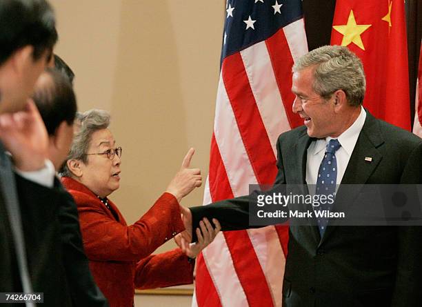 President George W. Bush jokes with visiting Chinese Vice Premier Wu Yi during a meeting at the White House May 24, 2007 in Washington, DC. The...