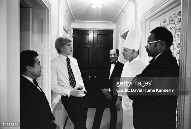 Steven Ford , son of President Gerald R. Ford, chats with White House Chef Henry Haller , waiter Johnny Johnson and other waiters prior to dining...