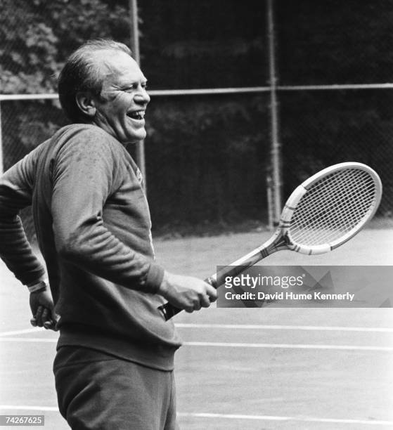 President Gerald R. Ford shares a laugh during a rousing tennis match with his son Steven Ford on September 1, 1974 during his first visit to Camp...