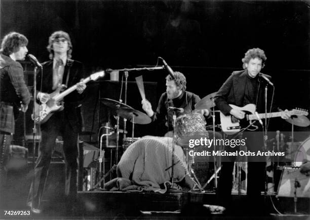 Bob Dylan and "The Band perform onstage in early 1974. Rick Danko, Robbie Robertson, Levon Helm, Bob Dylan.