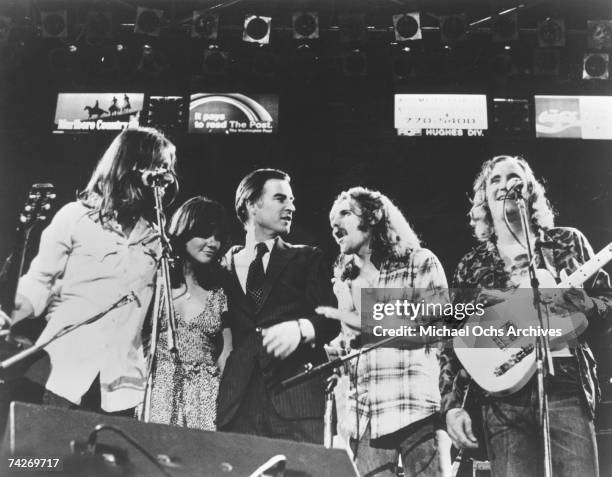 Glenn Frey and other members of the rock band "Eagles" on stage with California Governor Jerry Brown and Linda Ronstadt in circa 1976.