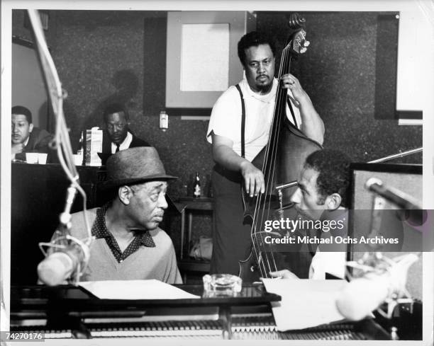 Composer Duke Ellington and bass player Charles Mingus during the recording of their album 'Money Jungle' which was released in 1962.