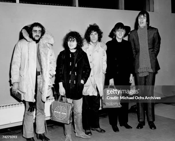 John McVie, Jeremy Spencer, Peter Green, Danny Kirwan and Mick Fleetwood of the rock group "Fleetwood Mac" pose for a portrait holding Pan Am bags in...