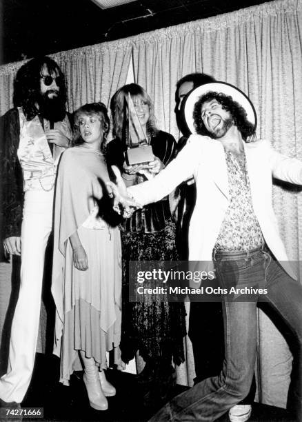 Fleetwood Mac pose for photographers backstage at the 5th American music Awards held at the Santa Monica Civic Auditorium on January 16, 1978 in...