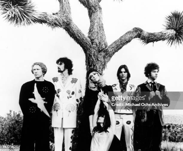 "Sneaky" Pete Kleinow, Chris Ethridge, Gram Parsons and Chris Hillman of the country rock group "The Flying Burrito Brothers" wear Nudie suits...