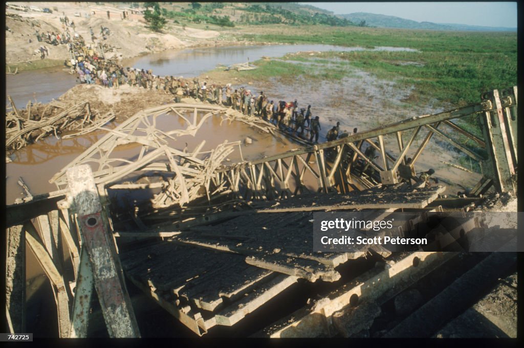 Ww1 Rwanda Patriotic Front of Rwanda soldiers cross a makeshift bridge June 3 ...