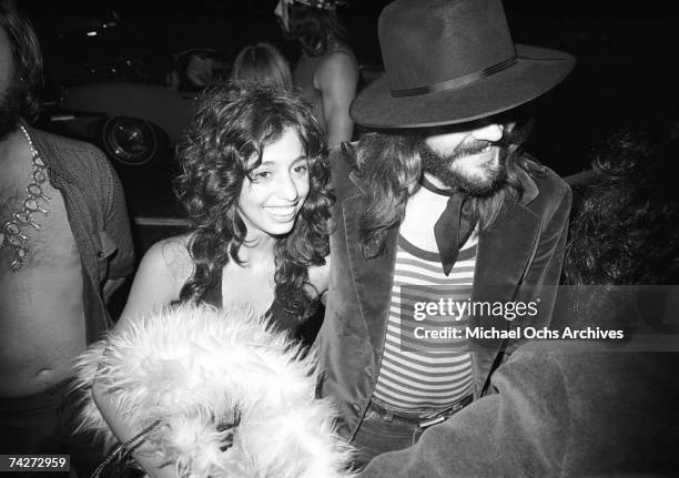 Drummer John Bonham of the rock band 'Led Zeppelin' arrives at Rodney Bingenheimer's English Disco with groupie Lori Mattix in June 1972 in Los...