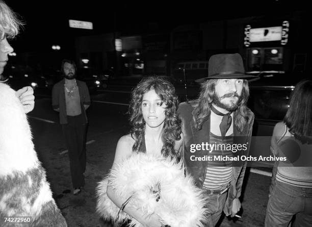 Drummer John Bonham of the rock band 'Led Zeppelin' arrives at Rodney Bingenheimer's English Disco with groupie Lori Mattix in June 1972 in Los...