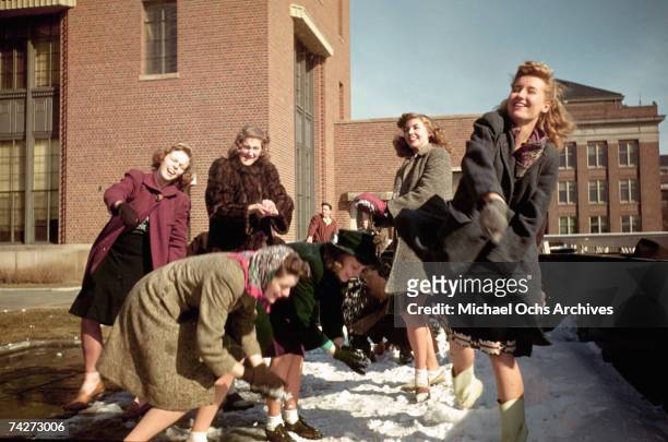 Students throw snowballs at the University of Minnesota, Twin Cities circa 1940 in Minneapolis, Minnesota.