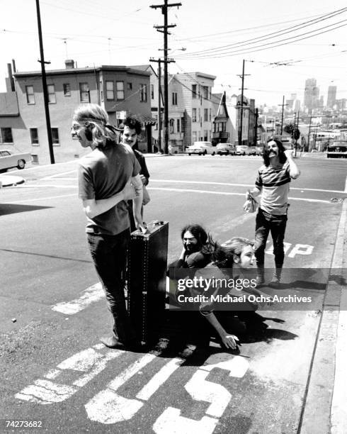 Phil Lesh, Bill Kreutzmann, Jerry Garcia, Bob Weir, Mickey Hart of the rock and roll band "The Grateful Dead" pose for a portrait in the middle of...