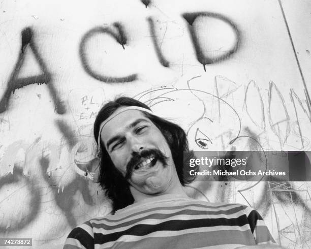 Mickey Hart of the rock and roll band "The Grateful Dead" poses for a portrait under graffiti that reads "Acid" on Portrero Hill in circa 1968 in San...