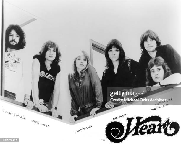 Michael Derosier, Steve Fossen, Nancy Wilson, Ann Wilson, Roger Fisher, Howard Leese of the rock band "Heart" pose for a portrait in circa 1975.