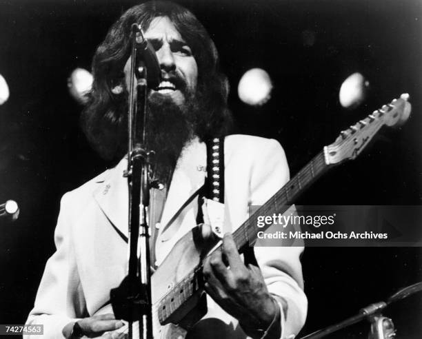 George Harrison performs onstage at the Concert for Bangladesh which was held at Madison Square Garden on August 1, 1971 in New York City, New York.