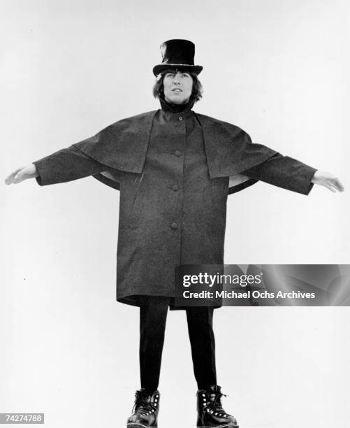 George Harrison of the rock and roll band "The Beatles" poses for a photo in the snow in March 1965 in Obertauern, Austria during a break from...