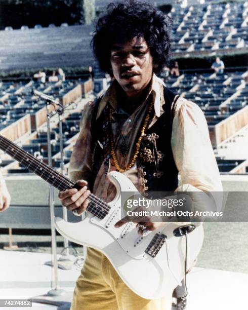 Rock guitarist Jimi Hendrix plays his Fender Stratocaster electric guitar onstage during soundcheck for his performance at the Hollywood Bowl on...