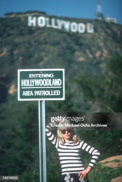 Singer Debbie Harry of the New Wave pop group "Blondie" poses for a portrait in March 1977 on a hill beneath the Hollywood Sign in Los Angeles,...