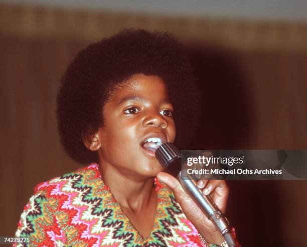 Pop singer Michael Jackson of the R&B quintet 'Jackson 5' performs onstage wearing a bright patterned shirt at a concert for the "Foundation for the...