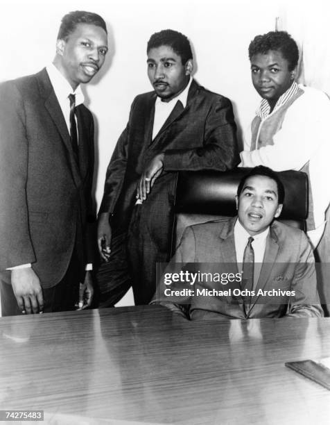 Producer and songwriters Mickey Stevenson, Brian Holland, Lamont Dozier with Smokey Robinson pose for a portrait circa 1965 in Detroit, Michigan.