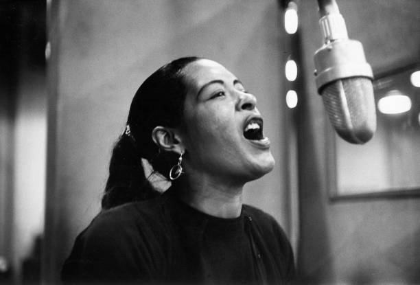 Billie Holiday records her penultimate album 'Lady in Satin' at the Columbia Records studio in December 1957 in New York City, New York.