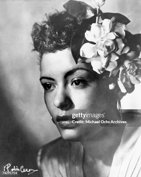 Jazz singer Billie Holiday poses for a portrait in circa 1939 with a flower in her hair.