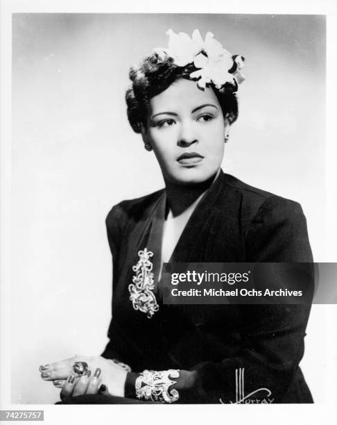 Jazz singer Billie Holiday poses for a portrait in circa 1939 with a flower in her hair.