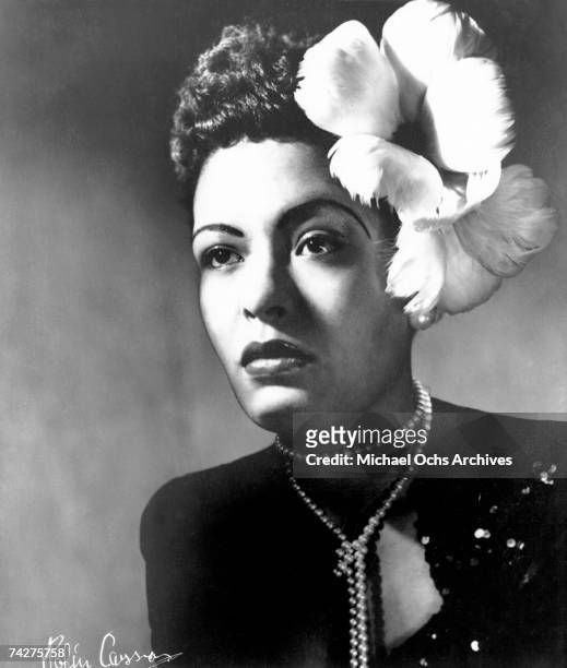 Jazz singer Billie Holiday poses for a portrait in circa 1939 with a flower in her hair.