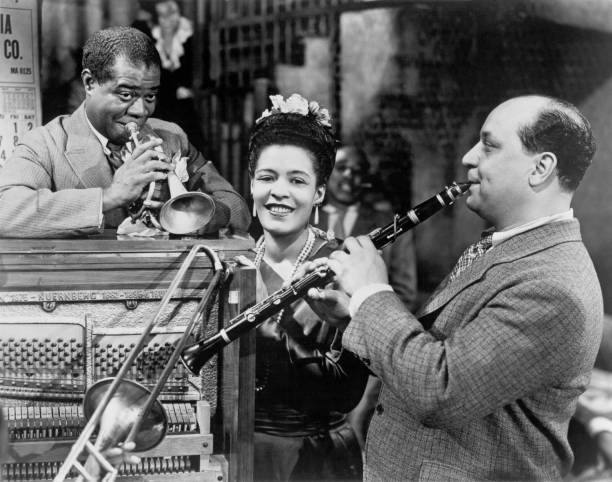 Louis Armstrong , Billie Holiday and Barney Bigard perform on the set of the musical "New Orleans" in 1947 in New Orleans, Louisiana. Billie Holiday...