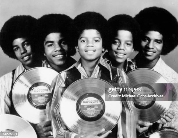 Quintet "Jackson 5" pose for a portrait holding commemorative copies of their "Third Album" to mark a milestone in sales in 1970. Jermaine Jackson,...