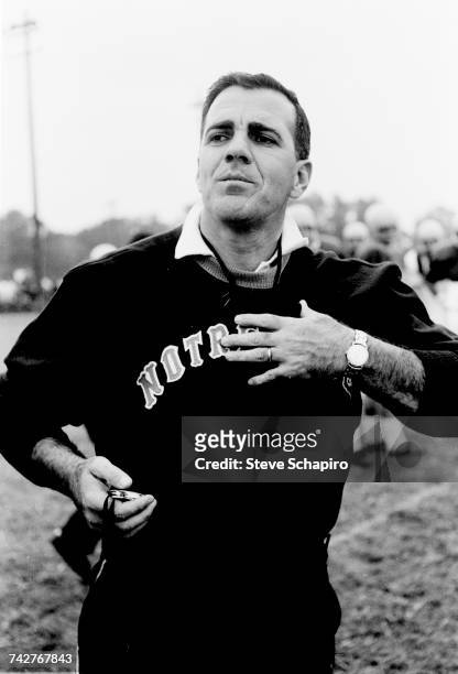 View of University of Notre Dame football coach Ara Parseghian as he conducts practice on the field, South Bend, Indiana, 1964.