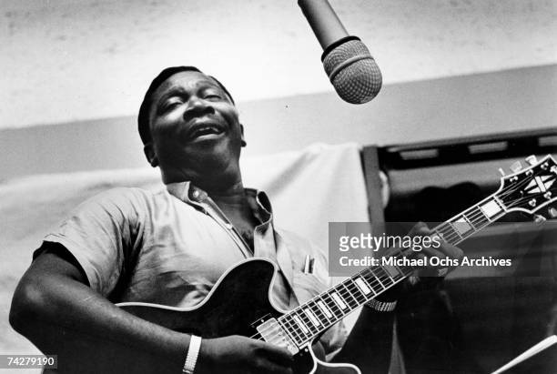 Blues musician BB King records in the studio with his 'Lucille' model Gibson hollowbody electric guitar in circa 1963.