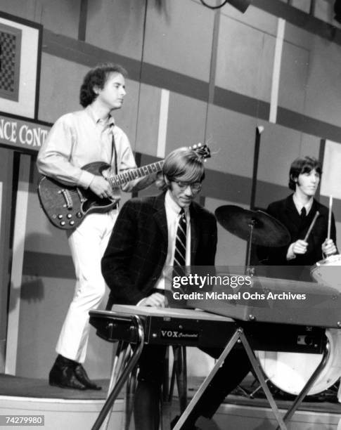 Rock group The Doors (L-R Robby Krieger, Ray Manzarek and John Densmore perform on 'Boss City' on KHJ-TV on May 15, 1967 in Los Angeles, California.