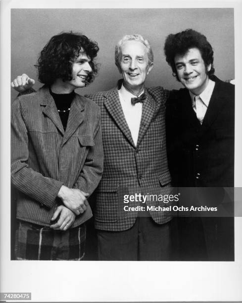 Blues and rock performers Al Kooper and Mike Bloomfield pose with artist Norman Rockwell who painted the cover of their album 'The Live Adventures of...
