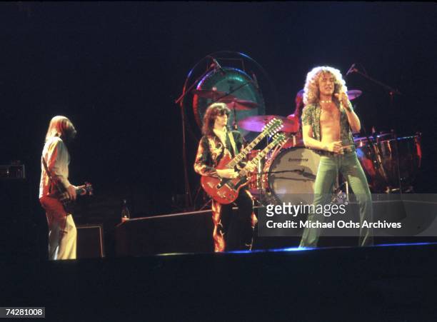 Bassist John Paul Jones, singer Robert Plant and guitarist Jimmy Page of the rock band 'Led Zeppelin' perform onstage at the Forum on June 24, 1977...