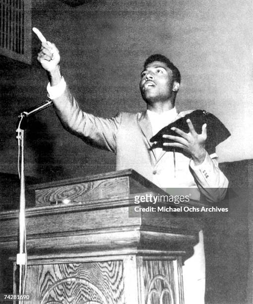 Rock and roll singer Little Richard preaches from the pulpit as he holds the bible after he quit rock and roll in circa 1958 only to return to it in...