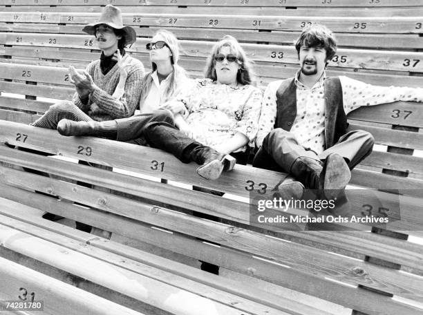 The folk group "The Mamas And The Papas" including John Phillips, Mama Cass, Michelle Phillips, and Denny Doherty pose for portraits and rehearse for...