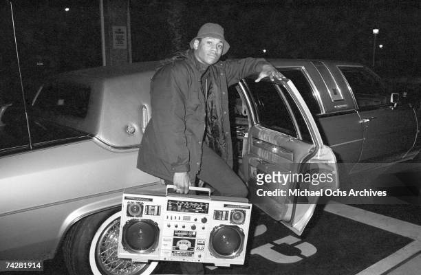 Rapper LL Cool J holds a boombox outside a concert, circa 1986.
