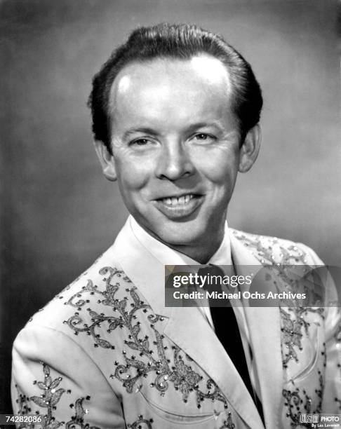 Country singer Charlie Louvin of "The Louvin Brothers" poses for a portrait wearing an embroidered Nudie Cohn style suit in circa 1958.