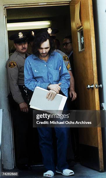 American criminal and cult leader Charles Manson is escorted by Los Angeles County sheriffs to a police van to the Santa Monica Courthouse to appear...