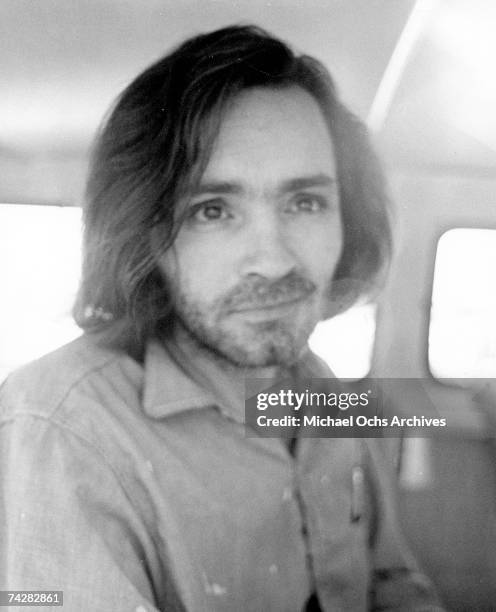 American criminal and cult leader Charles Manson traveling on a police van to the Santa Monica Courthouse to appear in court for a hearing regarding...