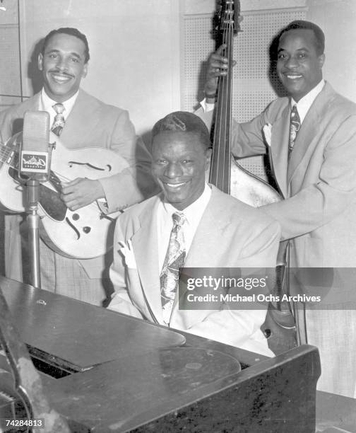 Guitarist Oscar Moore, bassist Johnny Miller and pianist Nat "King" Cole of the "Nat 'King' Cole Trio" pose for a portrait on April 5, 1946 in Los...