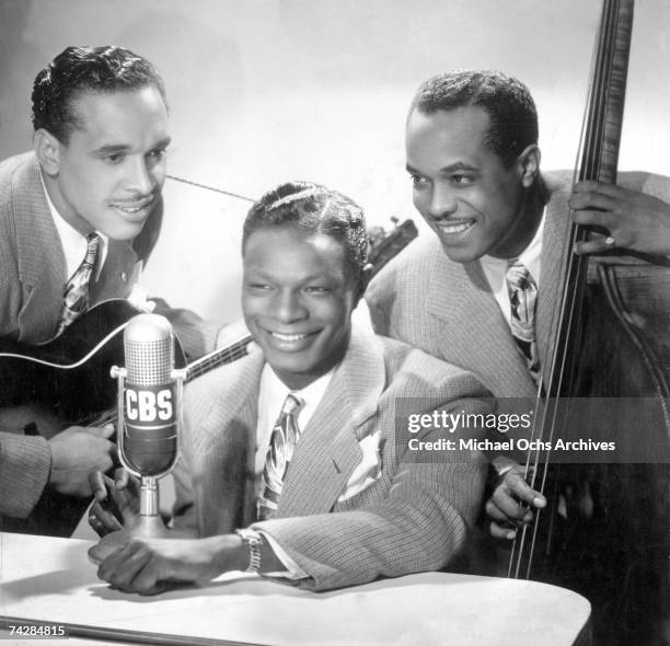 Pianist Nat 'King' Cole, guitarist Oscar Moore and bassist Johnny Miller of the "Nat 'King' Cole Trio" pose for a portrait in circa 1945.