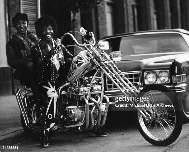 Sly Stone and his manager and producer Bubba Banks of the psychedelic soul group 'Sly and the Family Stone' rides a chopper on April 3, 1973 in San...