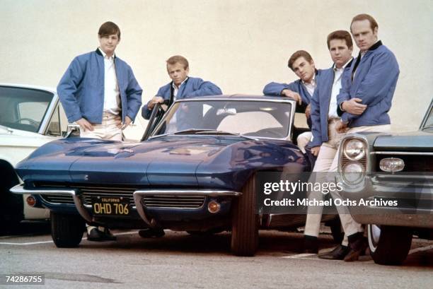 Rock and roll group "The Beach Boys" pose with Corvette in their first photo session since Al Jardine returned to the band in Novermber 1963. Brian...