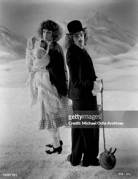 Roger Daltrey spoofs Charlie Chaplin as he plays composer Franz Liszt with an actress in a scene from the movie 'Lisztomania' which was released in...